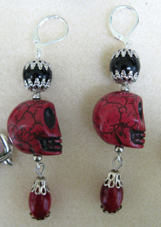 [Carolyn's red skull earrings]