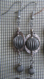 [Carolyn's steam grey earrings]