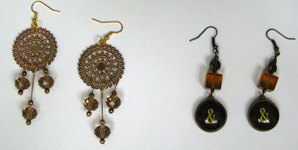 [Carolyn's wheel gold earrings]